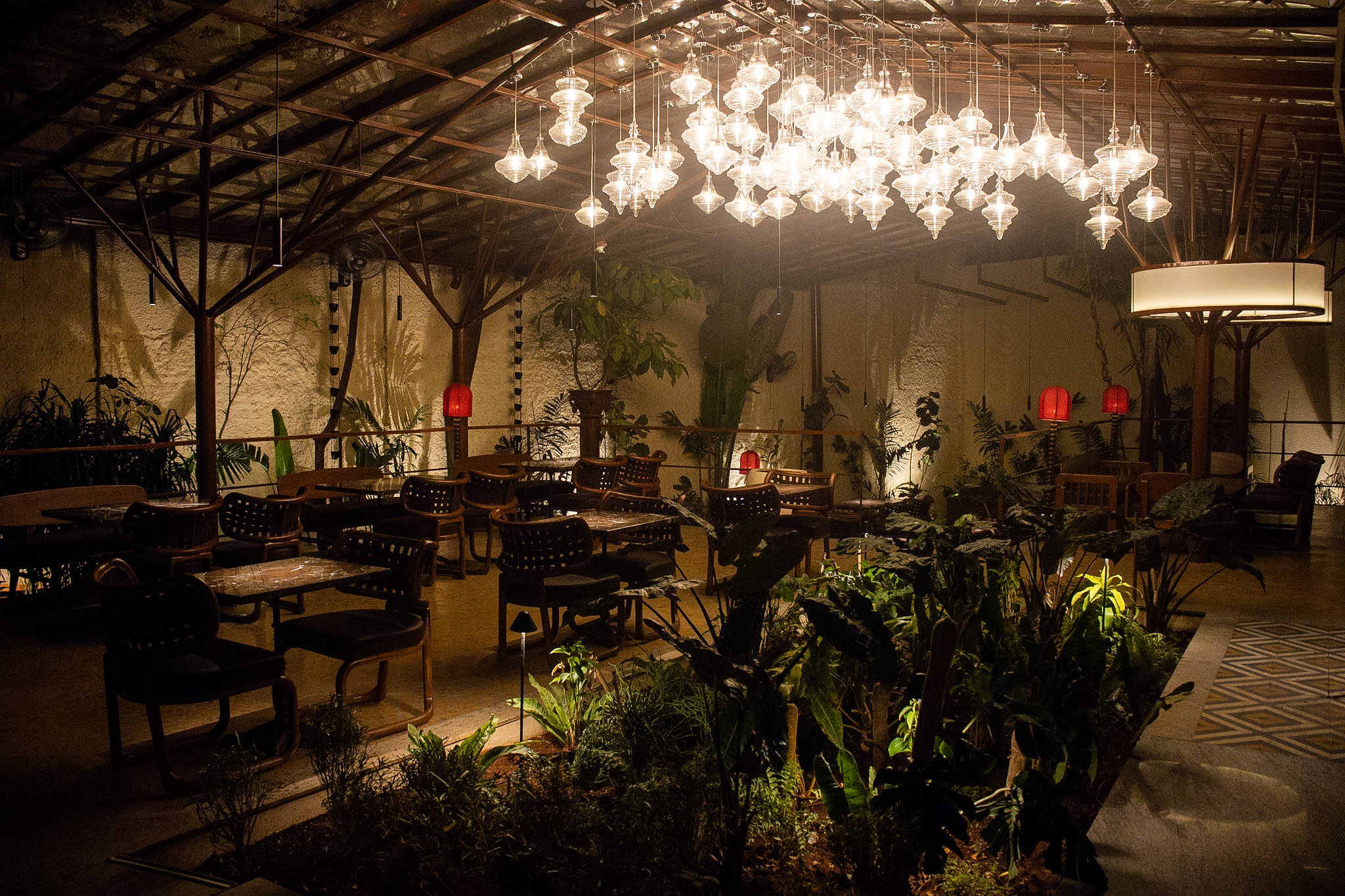 Grand dining room with warm pendant lighting and timber accents